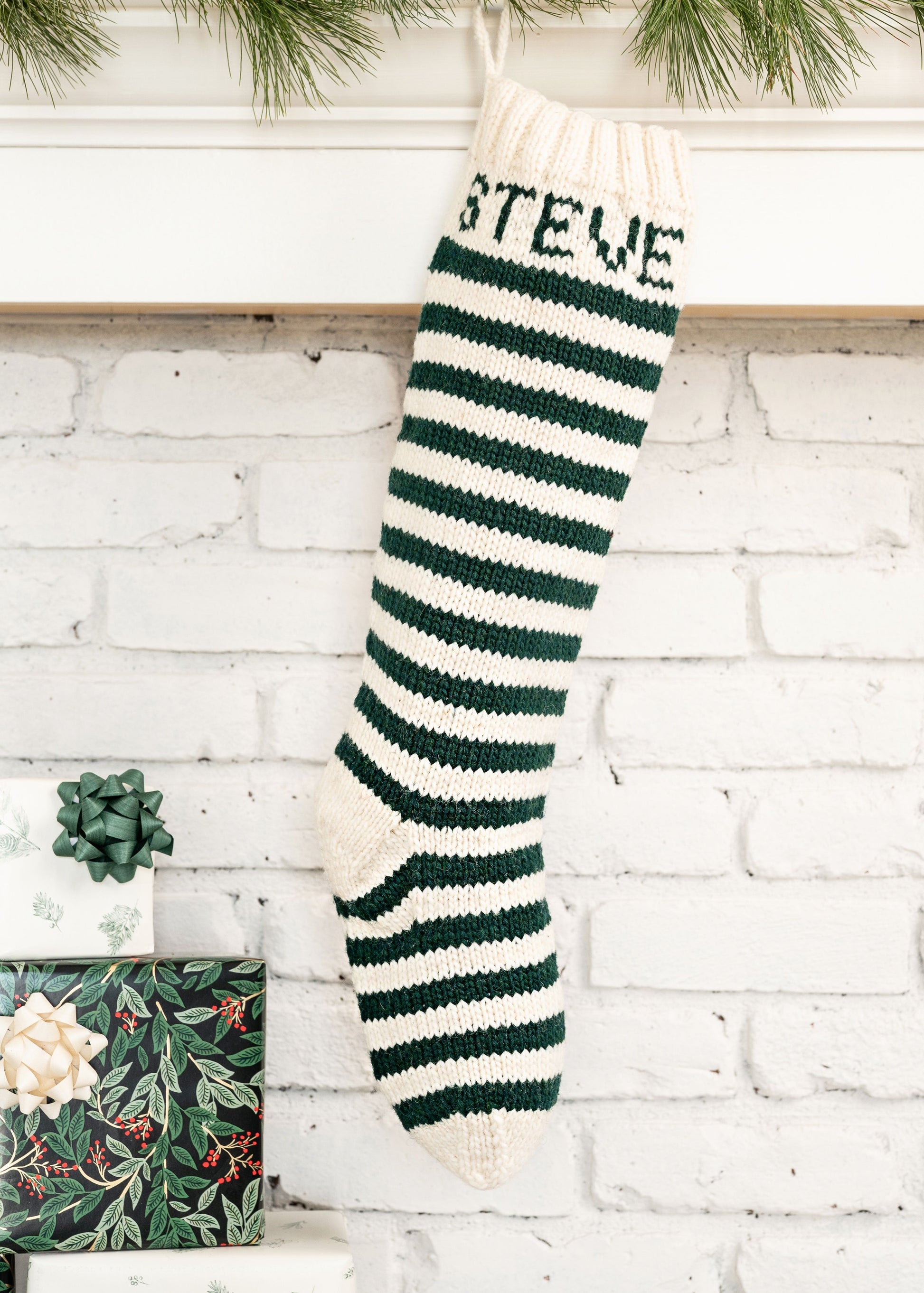 Christmas Stocking knitting kit featuring a whte and green striped design