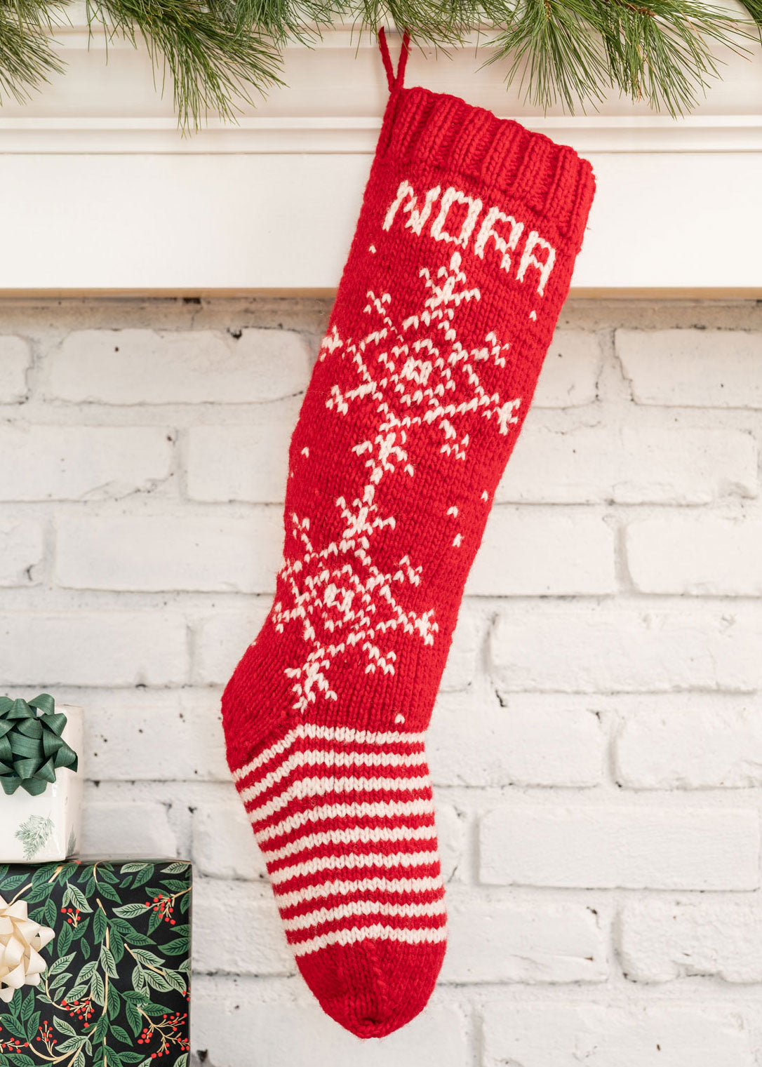 red Christmas stocking knitting kit with white snowflake design