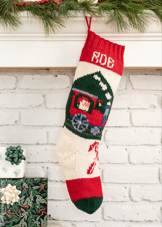 Christmas stocking knitting kit featuring a tain and a cute santa