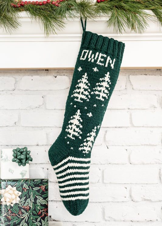 Green Christmas Stocking knitting kit featuring white trees